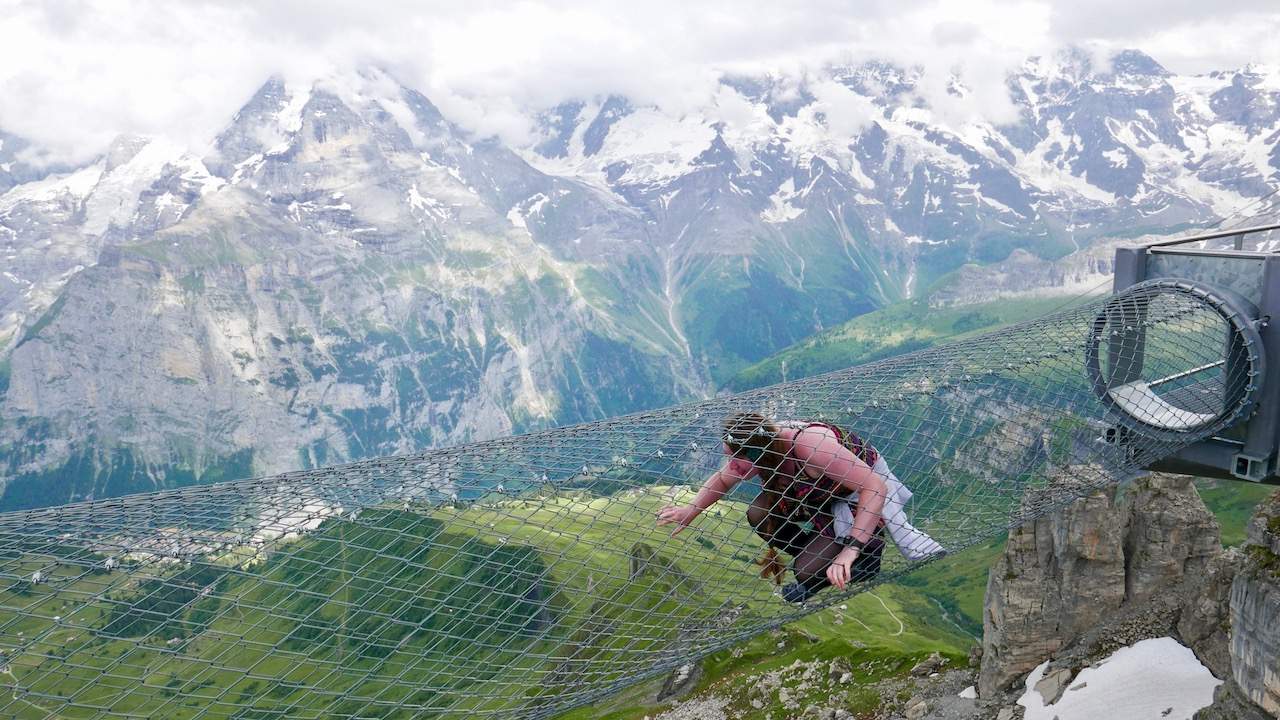 Attempting the eight-metre tunnel on the "Thrill Walk" 